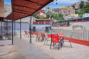 a group of chairs and tables on a patio at Doña Vicenta Casa Colonial in Guanajuato