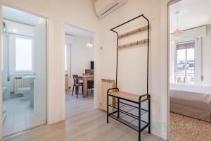 a bedroom with a mirror and a bed and a table at Mestre Homey Apartment by Bricola Apartments in Venice