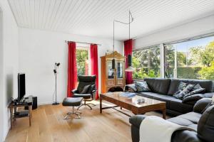 a living room with a couch and a table at 6763-Allinge-Sdr-Strandvej-69 in Allinge