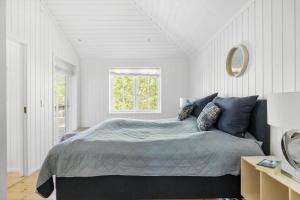 Ένα ή περισσότερα κρεβάτια σε δωμάτιο στο 3609-Nexo-Tangvej-5-A