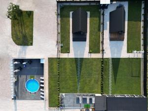 an overhead view of a yard with a swimming pool at Dravis Event Park in Beşalma
