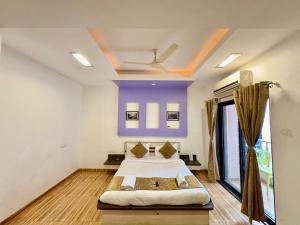 Postel nebo postele na pokoji v ubytování Le Tranquil Resort