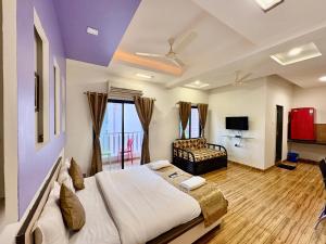 TV a/nebo společenská místnost v ubytování Le Tranquil Resort + 19 fotografií