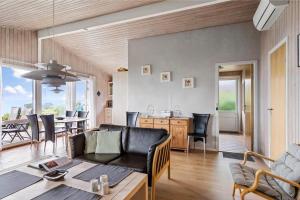 a living room with a couch and a table at 6683-Allinge-Brunekulvej-2-D in Allinge