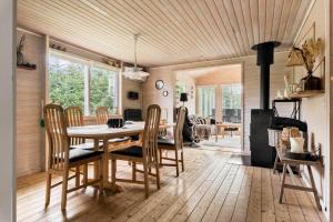 a dining room with a table and chairs at OH526-Hadsund-Ved-Fruerlund-32 in Hadsund