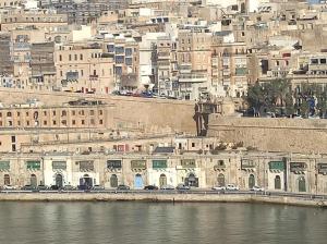a view of a city with buildings and a river at SeaFront Apartment In Valletta in Valletta