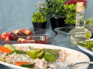 a plate of food on a table with a bowl of food at TAN OTEL in Mersin