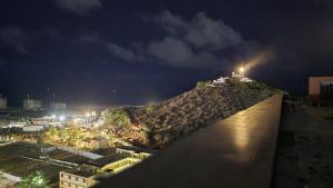 a view of a city at night at Adouna Appartement d'Exception vue sur mer in Dakar