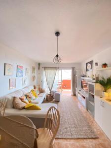 a living room with a large couch and a kitchen at Costa Adeje Dream View - 2 Bedroom Apartment with Terrace in Adeje