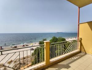 a balcony with a view of the beach at Eulalia Apartment in Cagliari