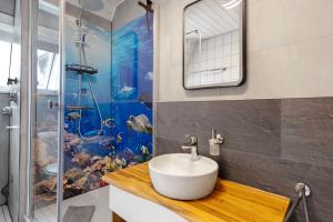 a bathroom with a sink and a shower at Casa Doro in Donaueschingen +14 photos