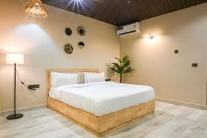 a bedroom with a large bed in a room at The Elysian Boutique Stays - Havelock in Havelock Island +24 photos