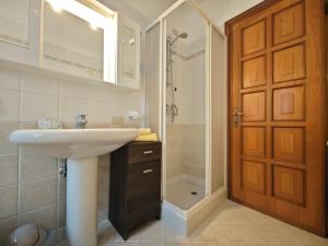 a bathroom with a sink and a shower at Terrazza Su Crosio a Clusone in centro! in Clusone +5 photos