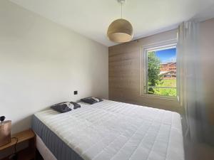 Postel nebo postele na pokoji v ubytování DBA202 - Appartement standing 4-5 pers + 12 fotografií