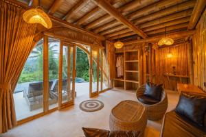 Χώρος καθιστικού στο Jiva Bali - Neve's Bamboo houses