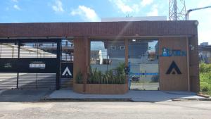 a store front with two large windows and a sign at Apartamento completo em Salinópolis in Salinópolis