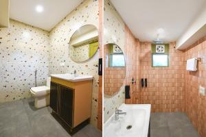 a bathroom with a sink and a toilet and a mirror at White Pepper in Faridabad +27 photos