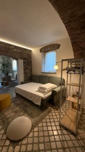 Ένα ή περισσότερα κρεβάτια σε δωμάτιο στο Suite Il Giardino dei Vescovi