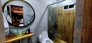 a bathroom with a sink and a mirror and a toilet at Green mount in Medellín +24 photos