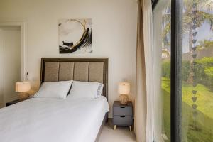 Voodi või voodid majutusasutuse VILLA CORAL Tracadero Beach Resort toas +22 fotot