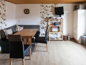 a living room with a table and a couch at Ernst Lakeside Escape in Ernst