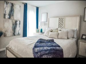 a bedroom with a large bed with a large window at The Reserve at Irondale in Birmingham