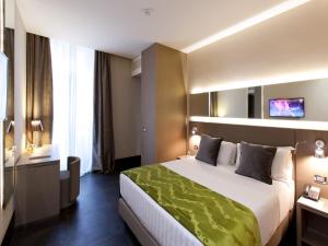 Posteľ alebo postele v izbe v ubytovaní Quirinale Luxury Rooms