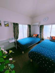 Ένα ή περισσότερα κρεβάτια σε δωμάτιο στο M-house