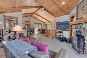 a living room with a couch and a fireplace at Modern 3BR Tahoe Cabin with Hot Tub in Tahoe City