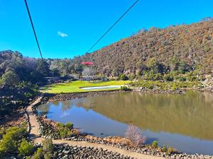 a view of a lake with a hill in the background at Commodore Regent Launceston in Launceston