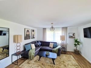 a living room with a couch and a table at ARGENTA Living 15 in Fulda