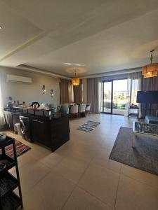 a living room with a couch and a table at فيلا Azha بالعين السخنه للعائلات in Ain Sokhna