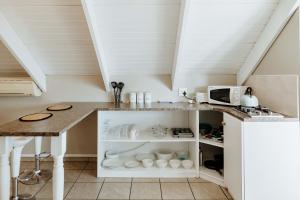 a kitchen with a table and a counter top at Paters Nessie in Paternoster