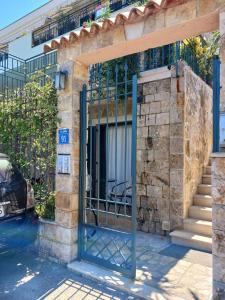an entrance to a building with a gate at Studio apartman Monte 2 in Tivat