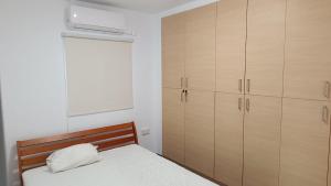 Postel nebo postele na pokoji v ubytování Light garden