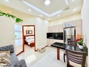 Kuchyň nebo kuchyňský kout v ubytování Sol y Confort Suites