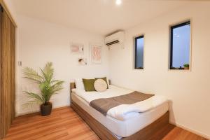 Postel nebo postele na pokoji v ubytování Tomo House Yotsuya-Sanchome 101 - from 6 minutes station 四谷三丁目 101 駅から徒歩6分