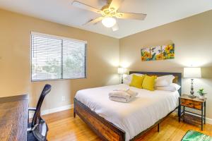a bedroom with a bed with a ceiling fan at Avondale Abode Pool, Lake Views and On-Site Fishing in Avondale +36 photos