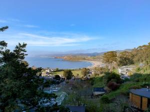 a view of a beach and a body of water at Coastal Charm - Oceanview Stay in Pacifica Near SF in Pacifica