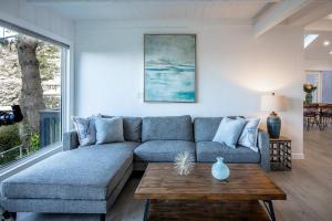 a living room with a couch and a table at Coastal Charm - Oceanview Stay in Pacifica Near SF in Pacifica