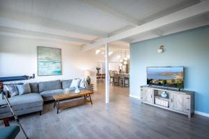 a living room with a couch and a table at Coastal Charm - Oceanview Stay in Pacifica Near SF in Pacifica +30 photos
