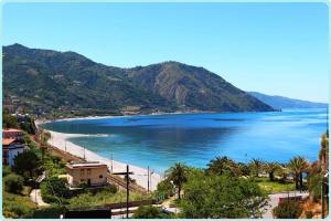 a view of a beach and the ocean at Michelangelo's House in Gioiosa Marea