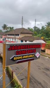 a sign for a jacobsciplinarycommidents rooms available at Jagadeeshwara comforts kalasa in Kalasa