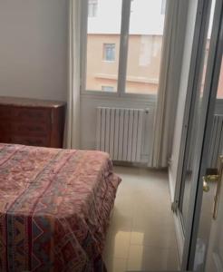Katil atau katil-katil dalam bilik di Appartement f3