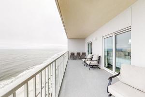 a balcony with chairs and a view of the ocean at Seawind 1804 in Gulf Shores +34 photos