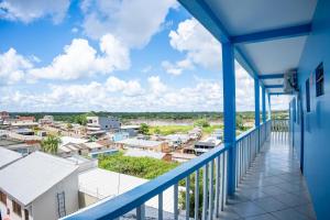 a balcony with a view of a city at SWAMY HOTEL ANEXO I in Cruzeiro do Sul