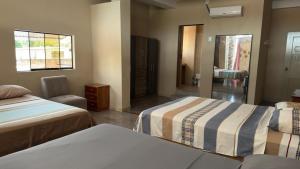 Ένα ή περισσότερα κρεβάτια σε δωμάτιο στο Casa de Perú Iquitos- Hotel & Restaurant