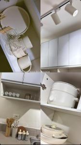 a kitchen with white cabinets and a toilet in it at Casa Lyra Staycation Trees Residences in Manila