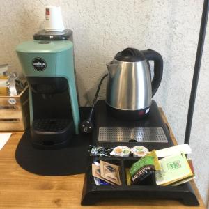 a coffee maker sitting on top of a table at B&B SMARTFIT HOUSE - Room & Relax in Pescara in Pescara +63 photos