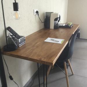 a wooden desk with a keyboard and a telephone at B&B SMARTFIT HOUSE - Room & Relax in Pescara in Pescara